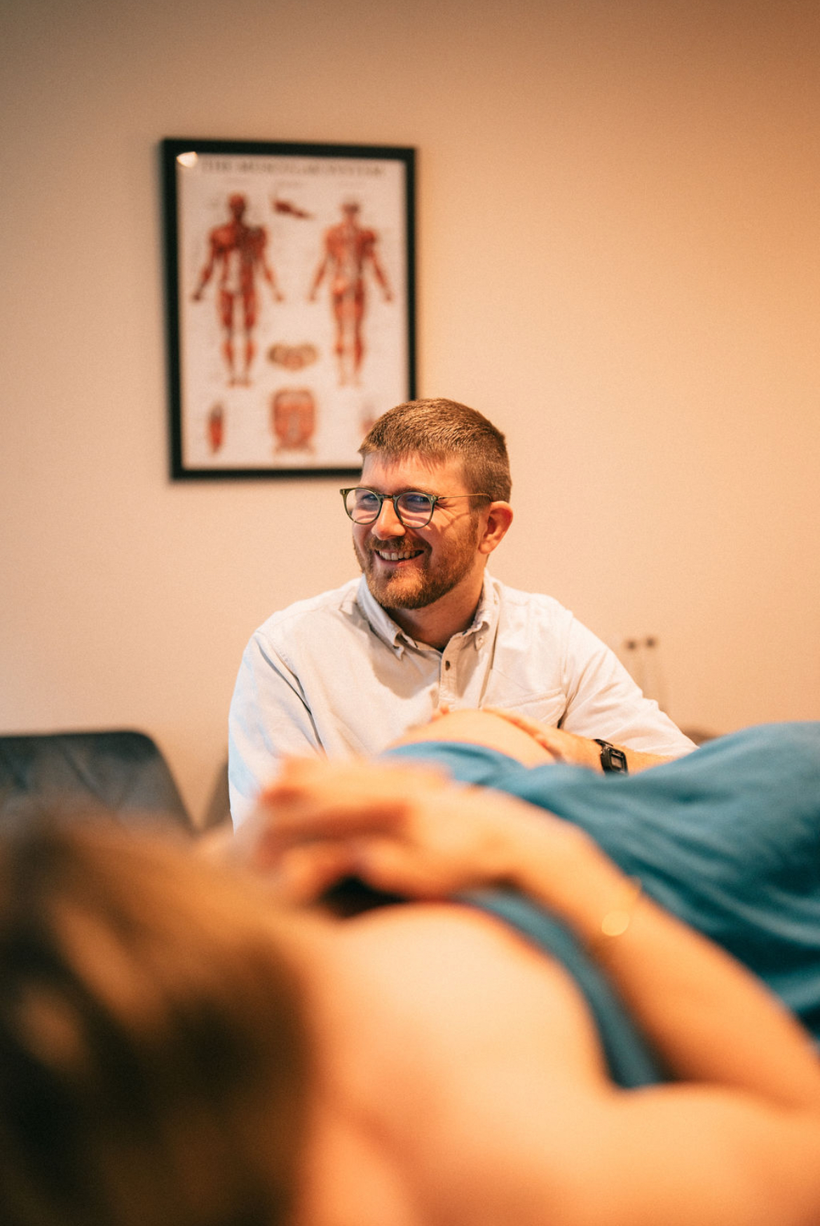 Osteopath with patient